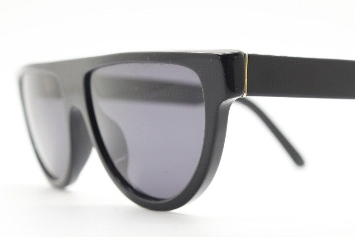 Retrosuperfuture thick flat top cat eye sunglasses hand made in Italy. All black gloss acetate frame. Vintage