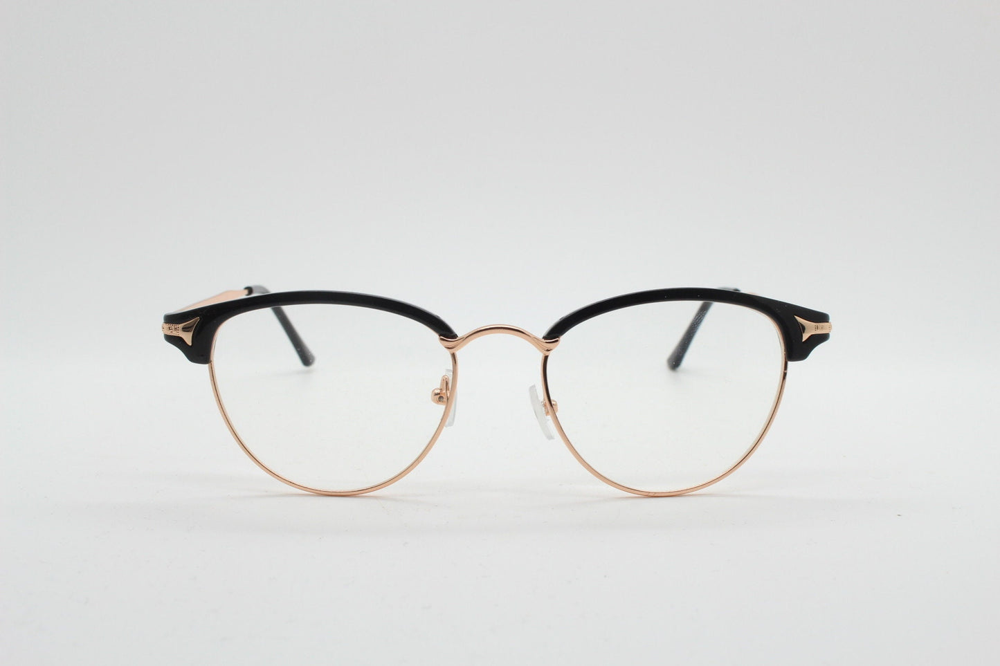 90s vintage browline cat eye glasses. Black gloss and gold half frame eyeglasses. 50s, 60s cateye design with clear lenses. NOS
