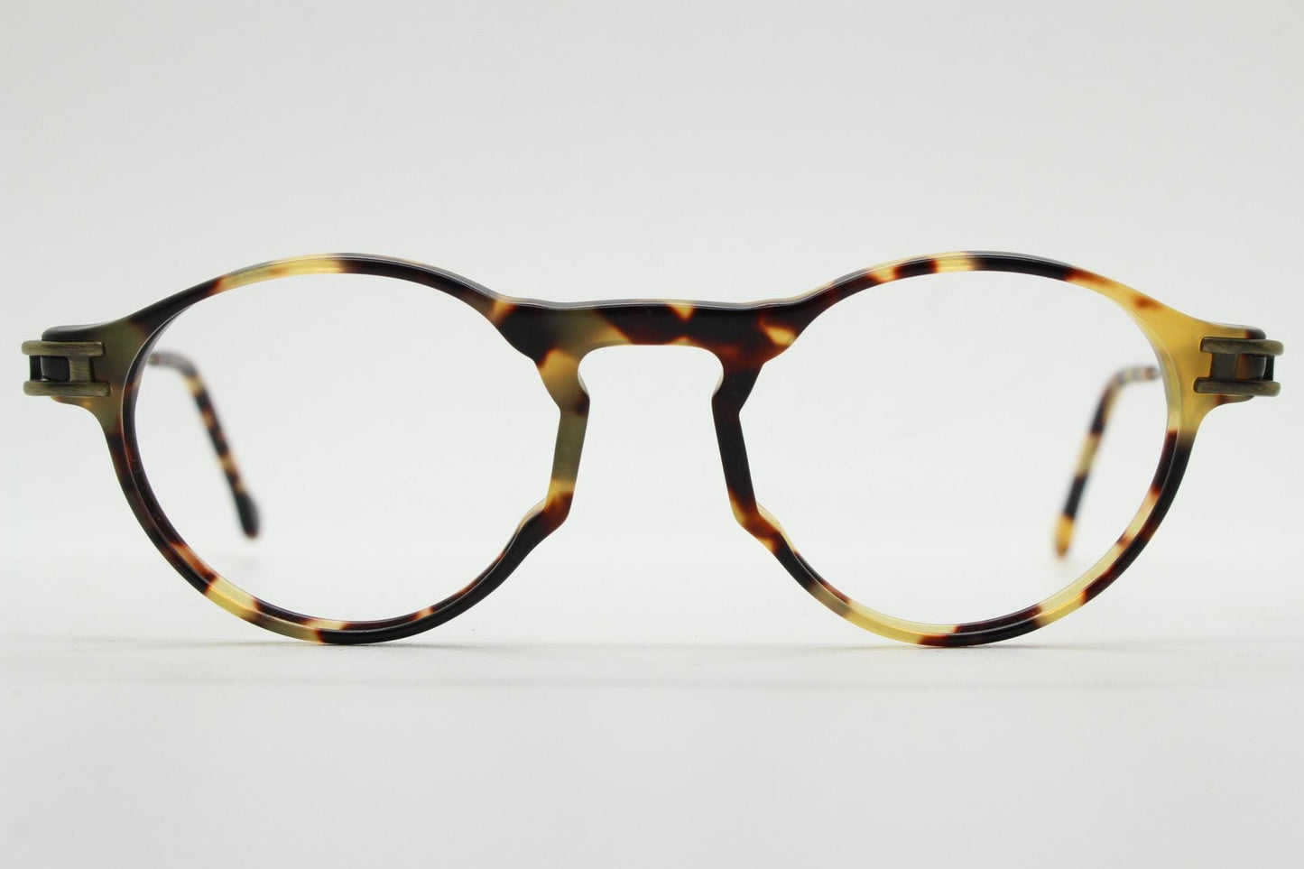 90s vintage oval eye glasses by No Limits. Honey tortoise optical frames with dynamic zig zag arms. Prescription RX spectacles. NOS