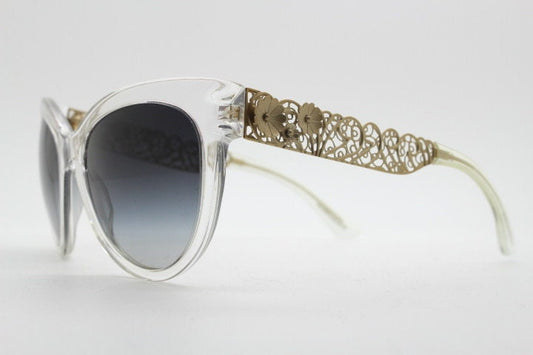 Dolce and Gabbana oversized cateye sunglasses model 4211. Womens transparent cat eye with cut-out florid metal arms and smoky lenses. NOS
