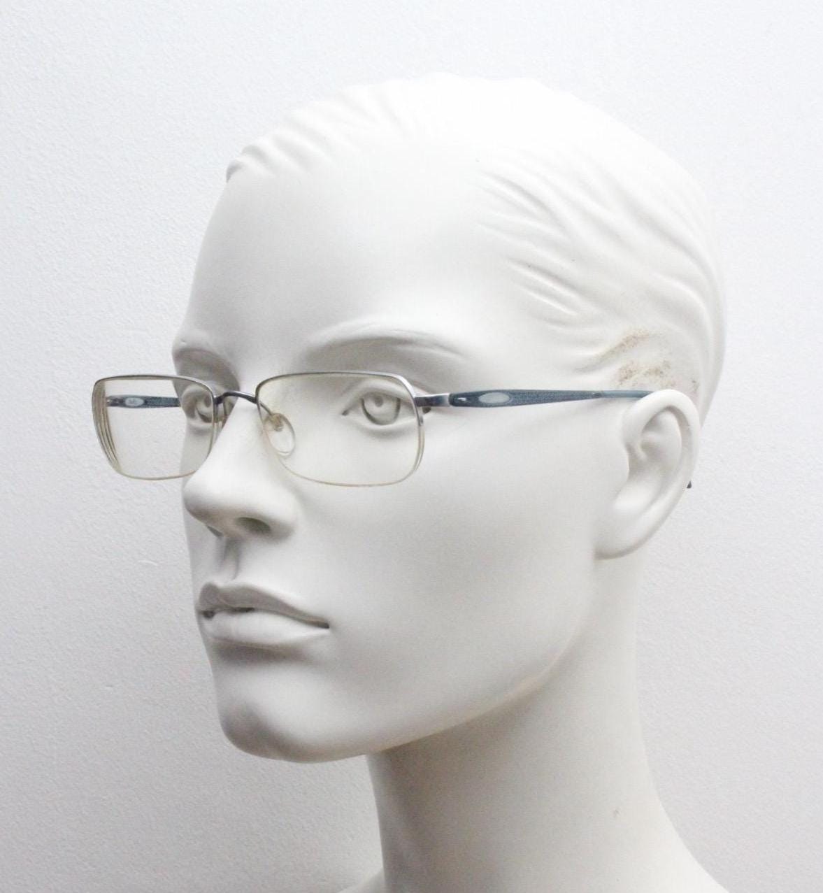 Silhouette rectangular half frame eye glasses made in Austria. Minimal brow line optical frame with patterned transparent arms. Prescription