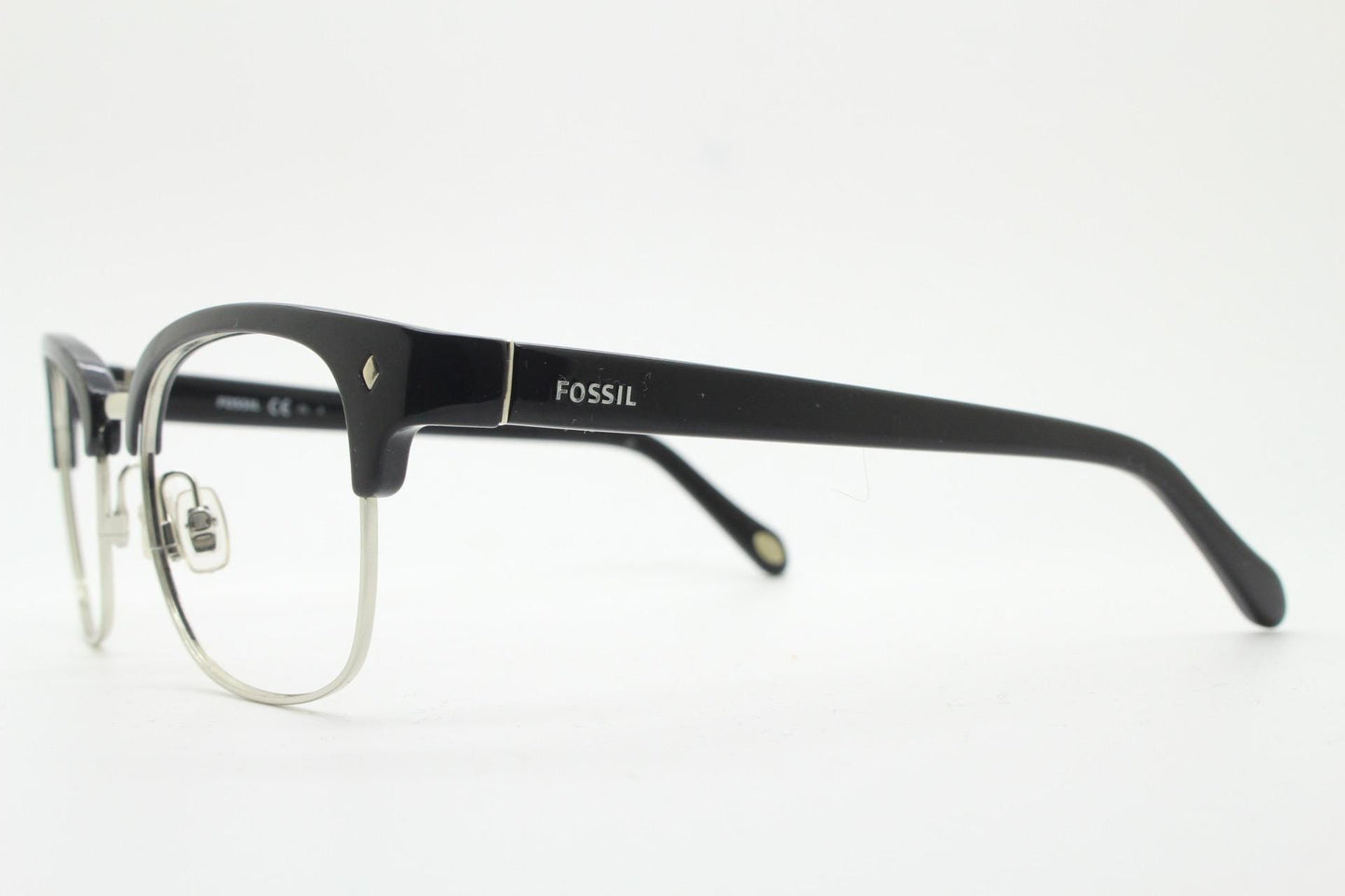 Fossil brow line eye glasses. Sharp and clean clubmaster format. Silver optical frames with black browline. Prescription eyeglasses. RX