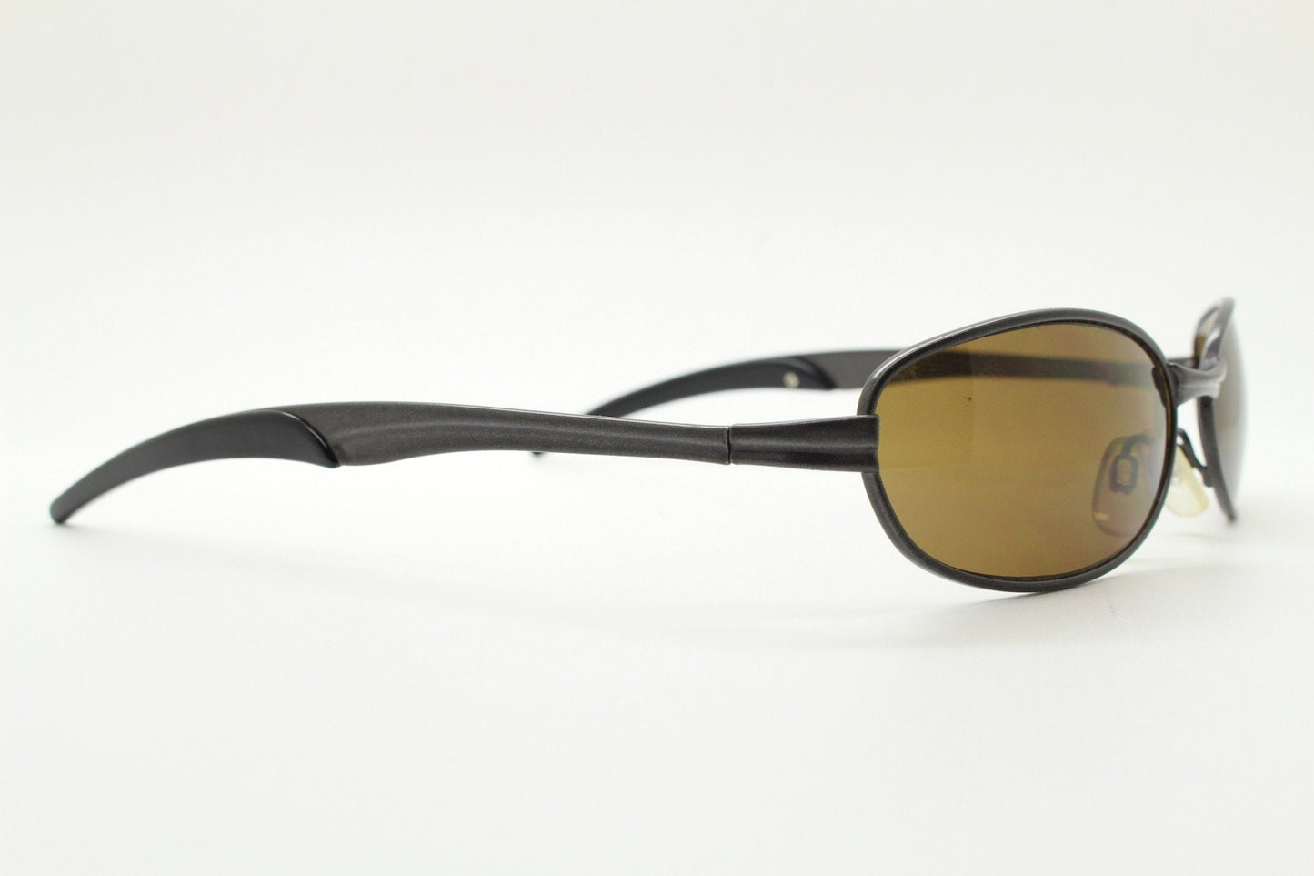 90s vintage oval small bug eye sunglasses. Curved brown satin finish solid metal frame with spear point rubber ends. Steampunk. Quality NOS