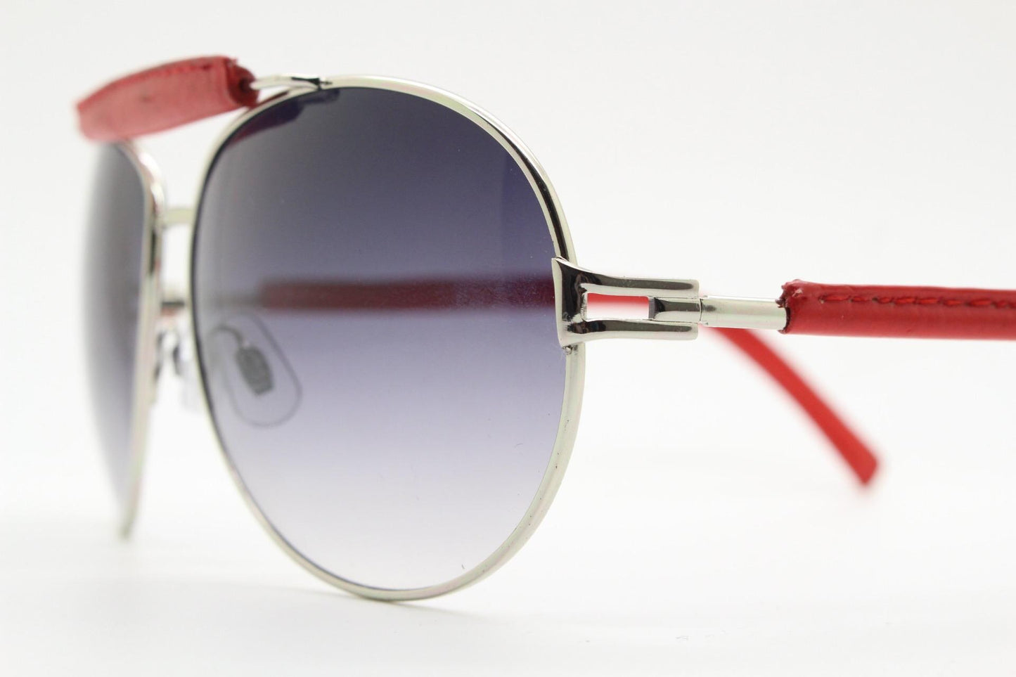 Y2K vintage aviator sunglasses. 2000's silver metal frame with exaggerated bridge in red trim. 70s racing design. 00's NOS aviators