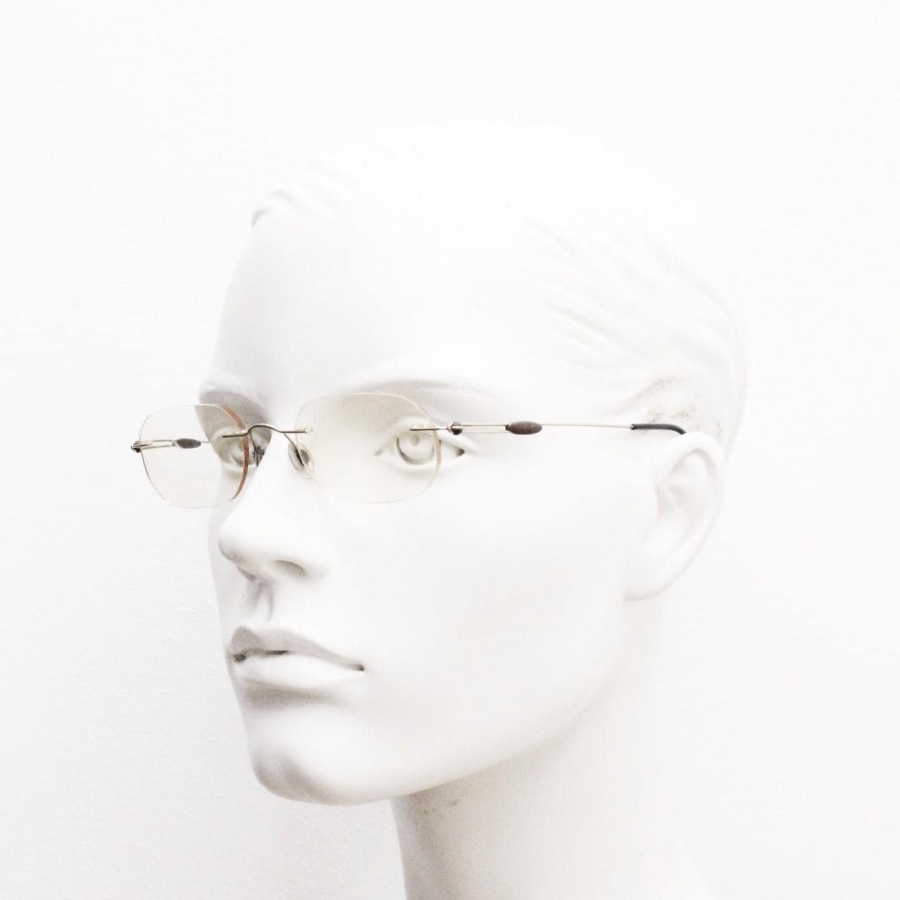 Silhouette vintage angular oval frameless eye glasses made in Austria. Minimal lightweight titanium optical frame. Prescription spectacles