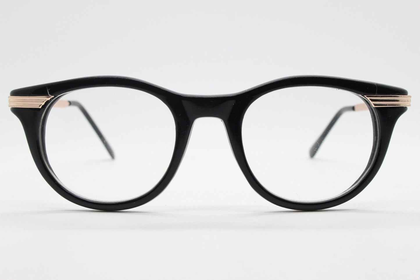 90s vintage cat eye glasses in black with gold metal arms. 50s, 60s style cateye prescription optical frames. Clear lens eyeglasses. RX