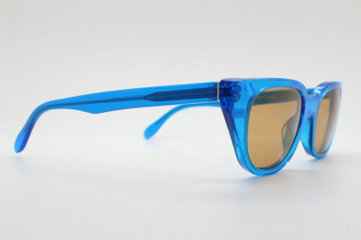 Retrosuperfuture thick cat eye sunglasses hand made in Italy. Intense blue acetate chunky frame with contrasting brown lenses. BNWOT
