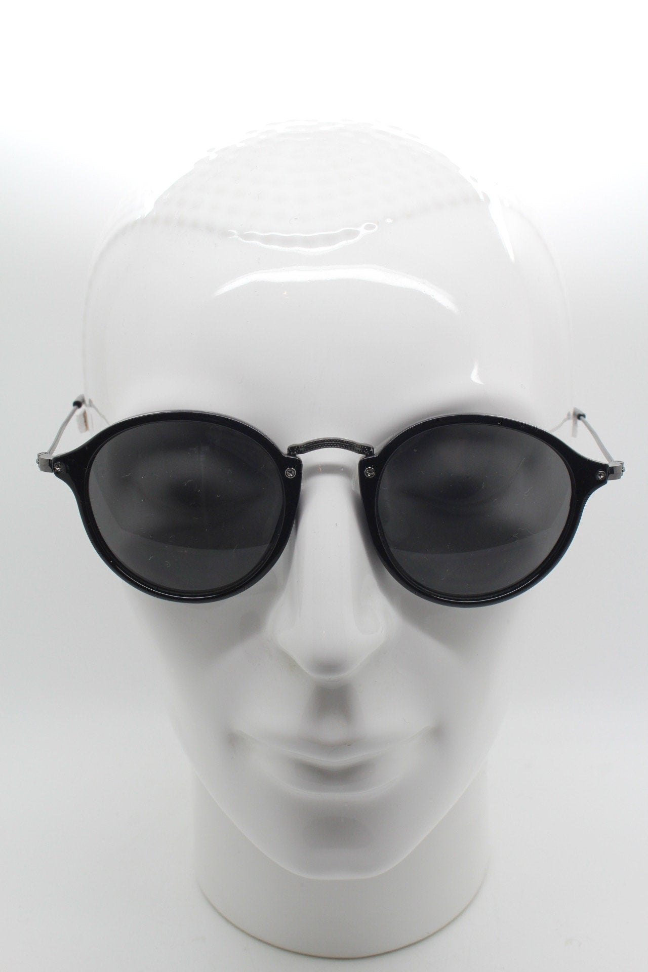 90s vintage round sunglasses. Black gloss slim 30s 40s design frame with metal bridge and dark lenses. Unused NOS