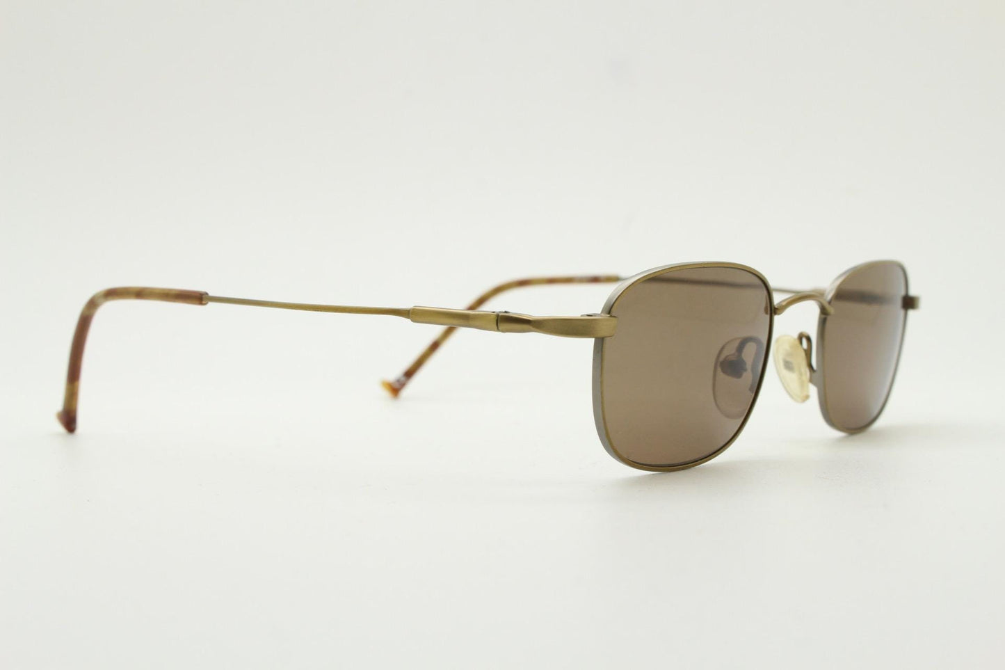 90s vintage small rectangular low profile metal sunglasses. Minimal slim frame in satin bronze finish with plain brown lenses. NOS. BNWT