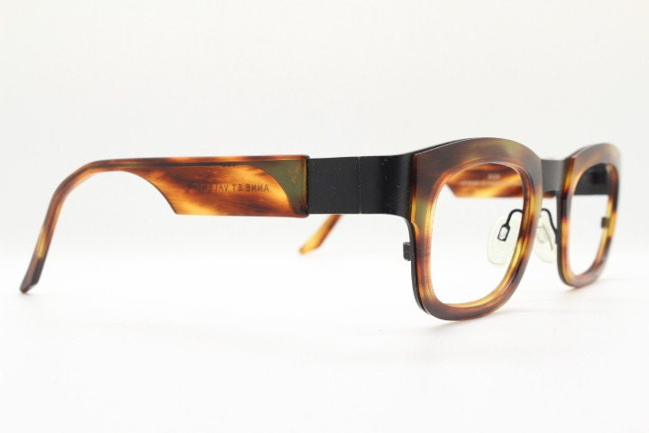 Anne et Valentin rectangular eye glasses hand made in France. Black matt titanium optical frame with mottled brown acetate. Prescription RX