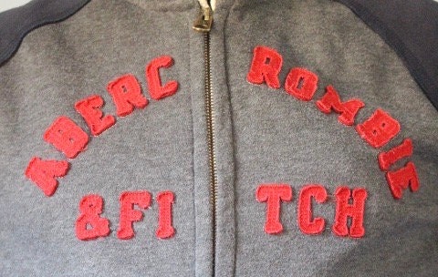 Abercrombie and Fitch grey and blue zipper sweat hoody with large red spell out patch letter chest logo. Mens all cotton medium size