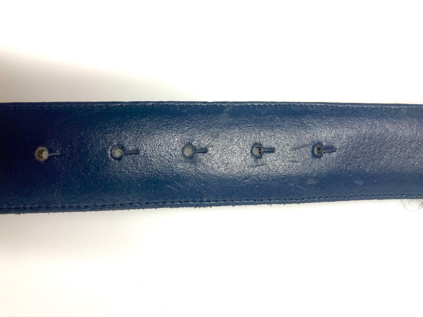 80s vintage womens dress belt in navy blue genuine leather with substantial gold chrome studded 'H' motifs. Made in France. Size S