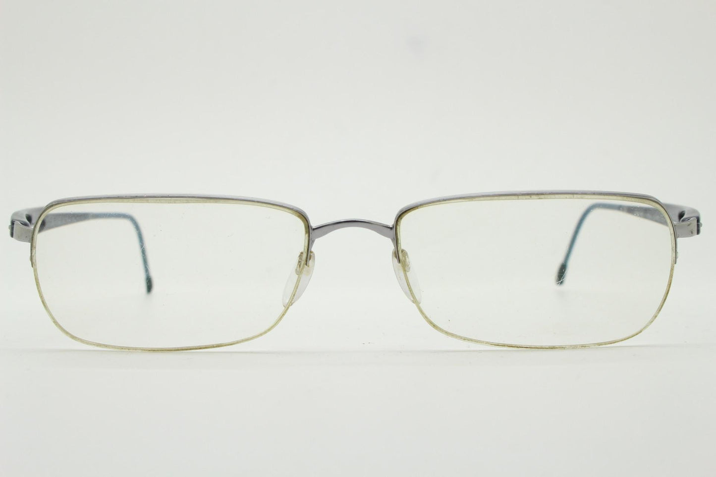 Silhouette rectangular half frame eye glasses made in Austria. Minimal brow line optical frame with patterned transparent arms. Prescription