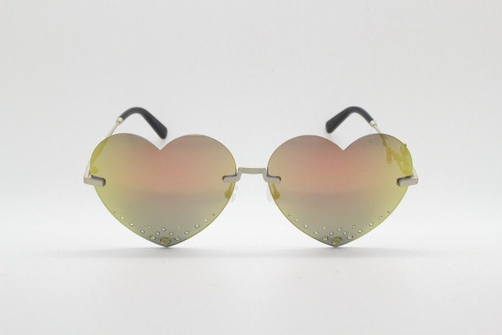 Kenzo mirror heart shaped frameless sunglasses model KZ40005U. Instant classic design with diamantes and big spell out arm logo. NOS