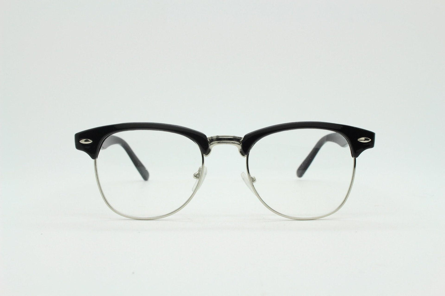 90s vintage black half frame eye glasses. Black gloss browline with silver wire rim frame and clear lenses. Classic 50s, 60s design. NOS