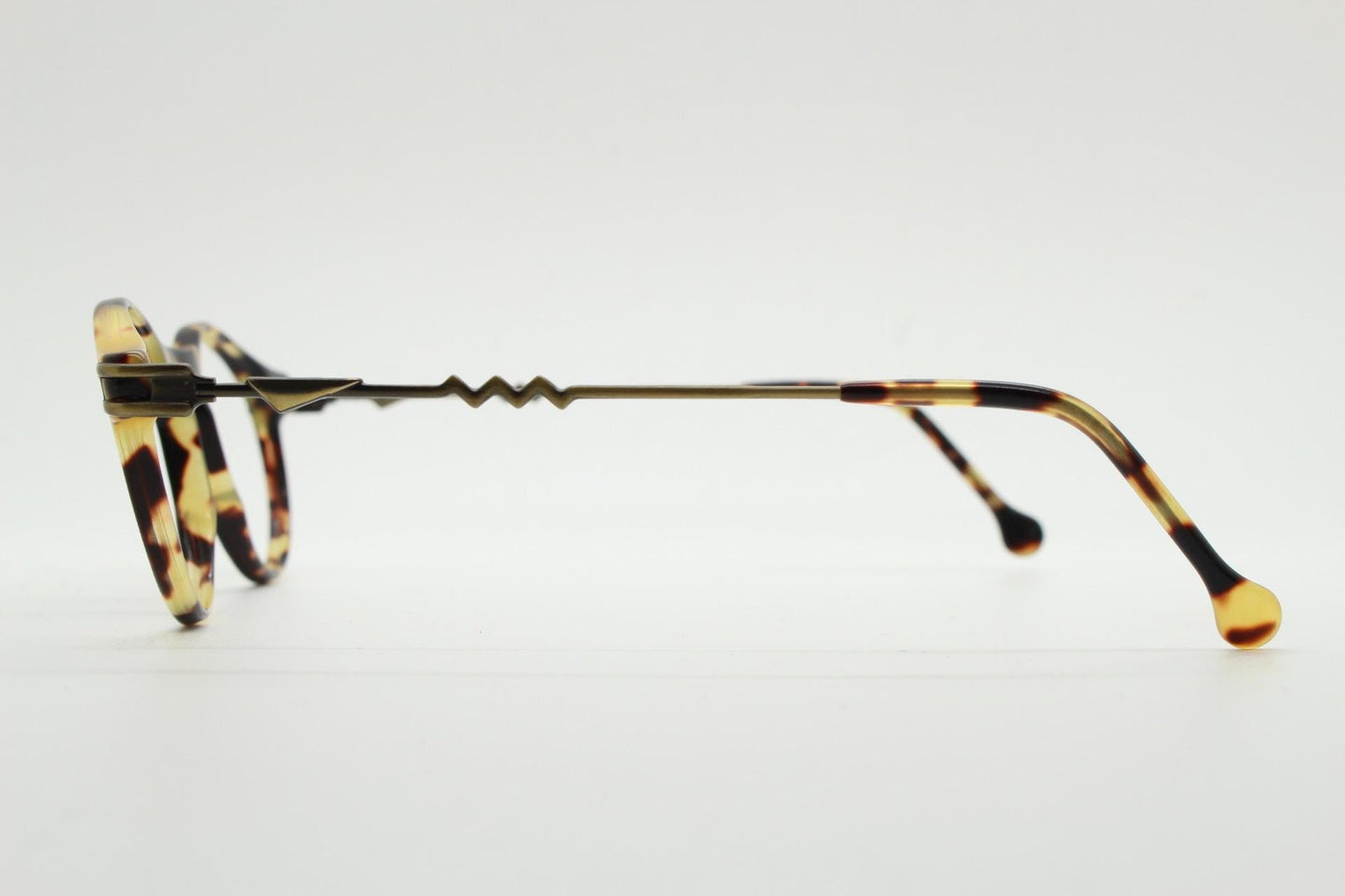 90s vintage oval eye glasses by No Limits. Honey tortoise optical frames with dynamic zig zag arms. Prescription RX spectacles. NOS