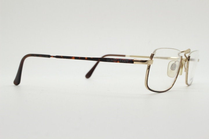 Giorgio Armani rectangular eye glasses made in Italy. Half frame underwire with metallic tortoise enamel. Prescription optical eyeglasses RX
