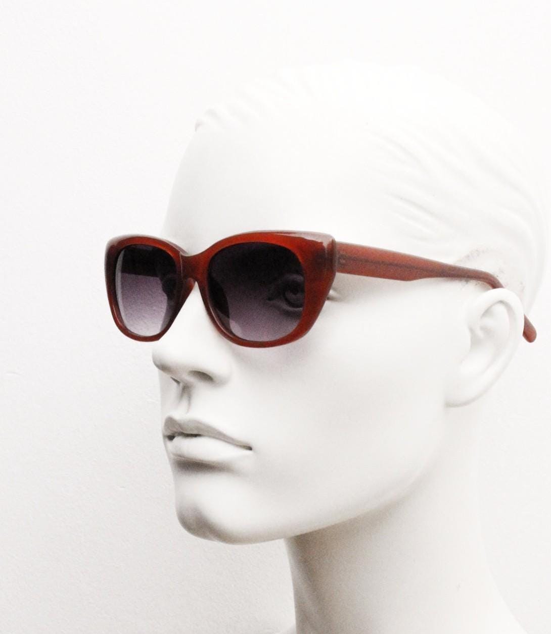 Vintage 90s rectangular cat eye sunglasses. Womens transparent brown acetate cateye in sensible proportions with graduating lenses. NOS