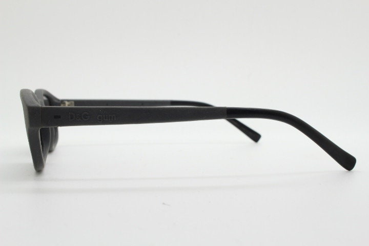 Dolce and Gabbana gum sunglasses made in Italy. Mens 90s vintage innovative flexible grey rubber frame with black lenses