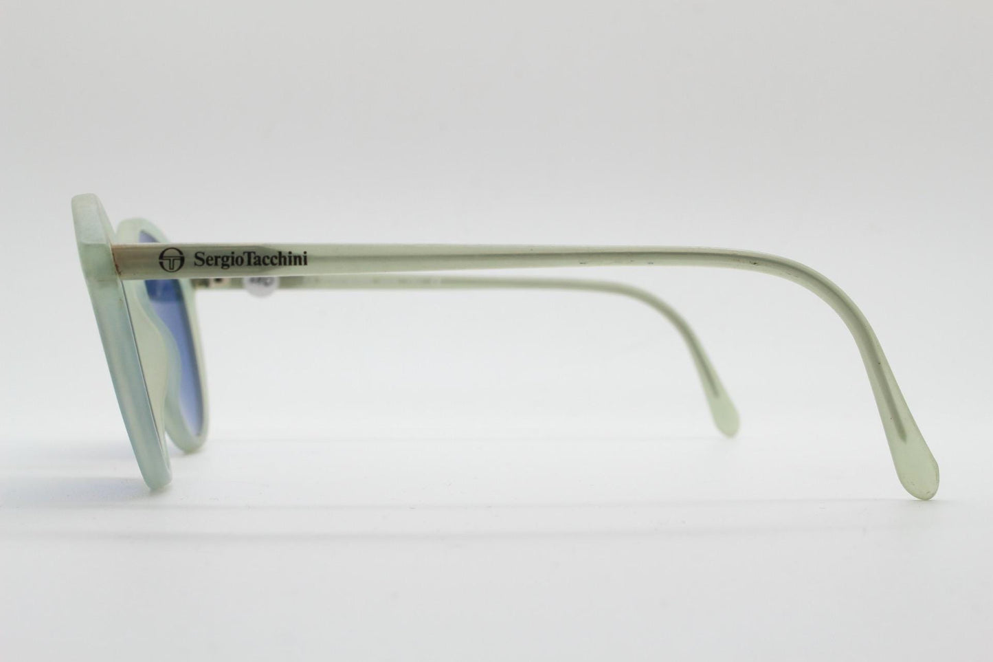 Sergio Tacchini 80s vintage round horn rim sunglasses made in Italy. Transparent pale blue frosted acetate frame with navy lenses. NOS