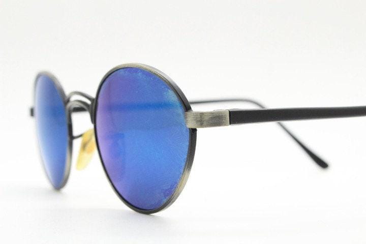 90s vintage oval panto sunglasses. Brushed bronze metal frame with cool blue mirror lenses and black slender arms. Unused NOS