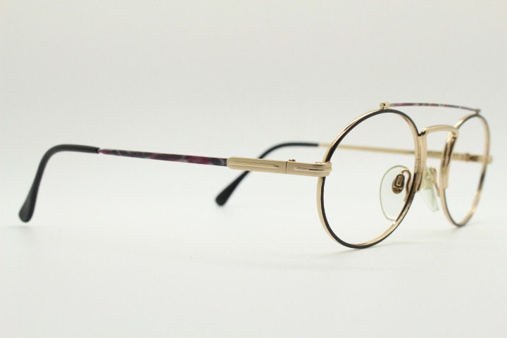 90s vintage oval eye glasses. Gold metal optical frame with vibrant enamel pattern and prominent double bridge. Prescription spectacles. NOS
