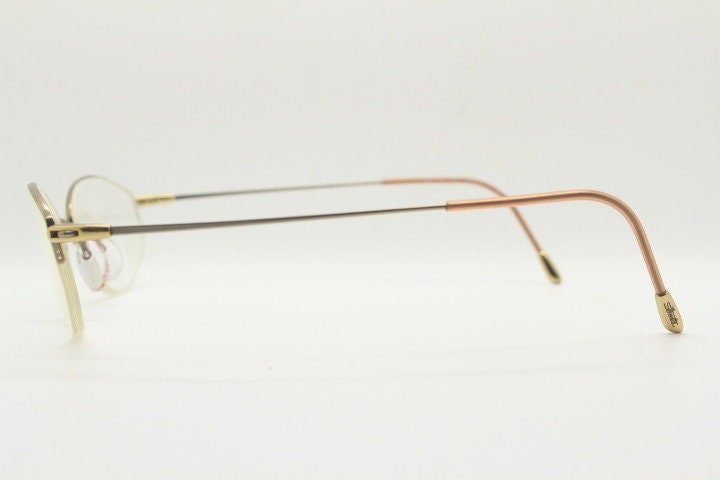 Silhouette oval half frame eye glasses model 6608 made in Austria. Minimal optical frame with extremely flexible wire arms. Prescription RX