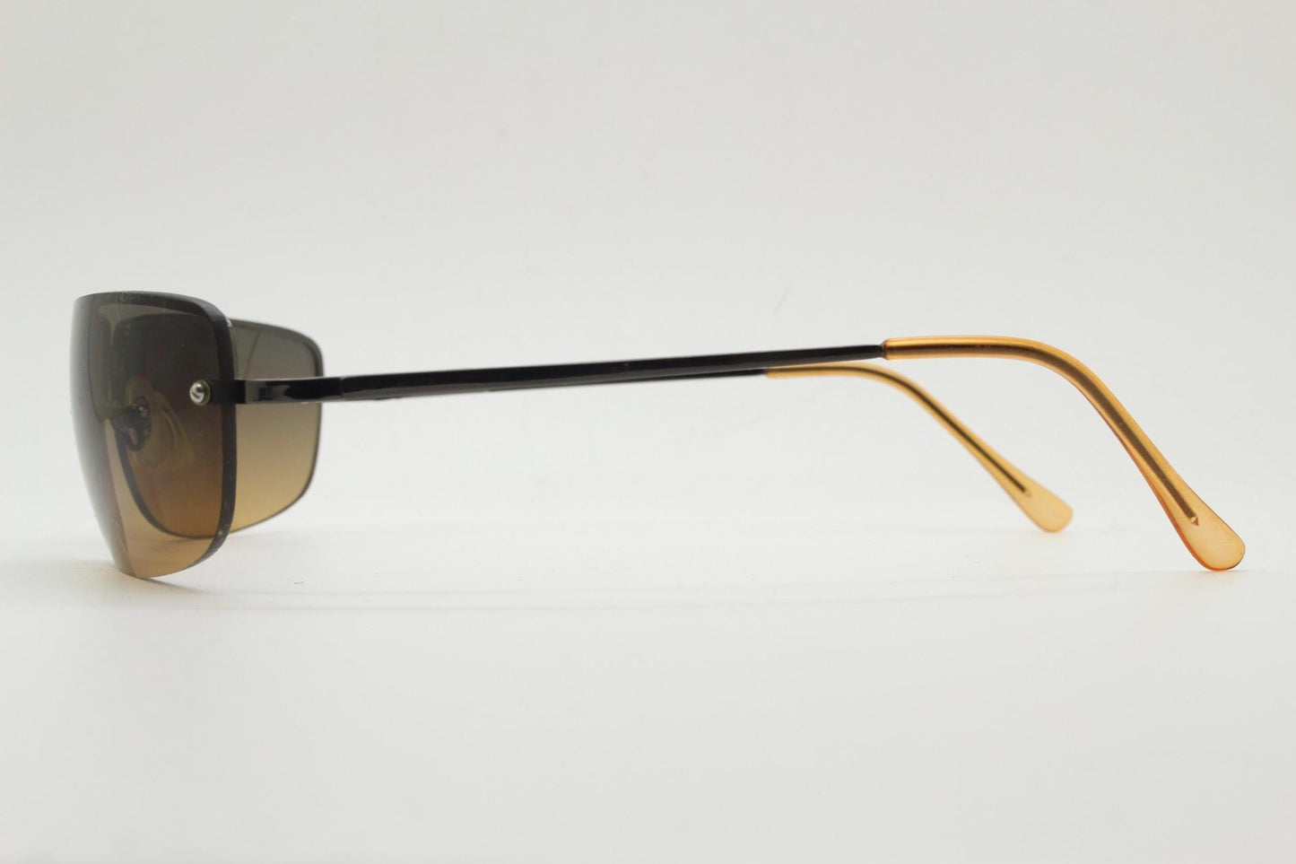 Y2K vintage curved rectangular sunglasses. Minimal half frame in brown chrome with grey to amber fade lenses. 2000's. 00's NOS