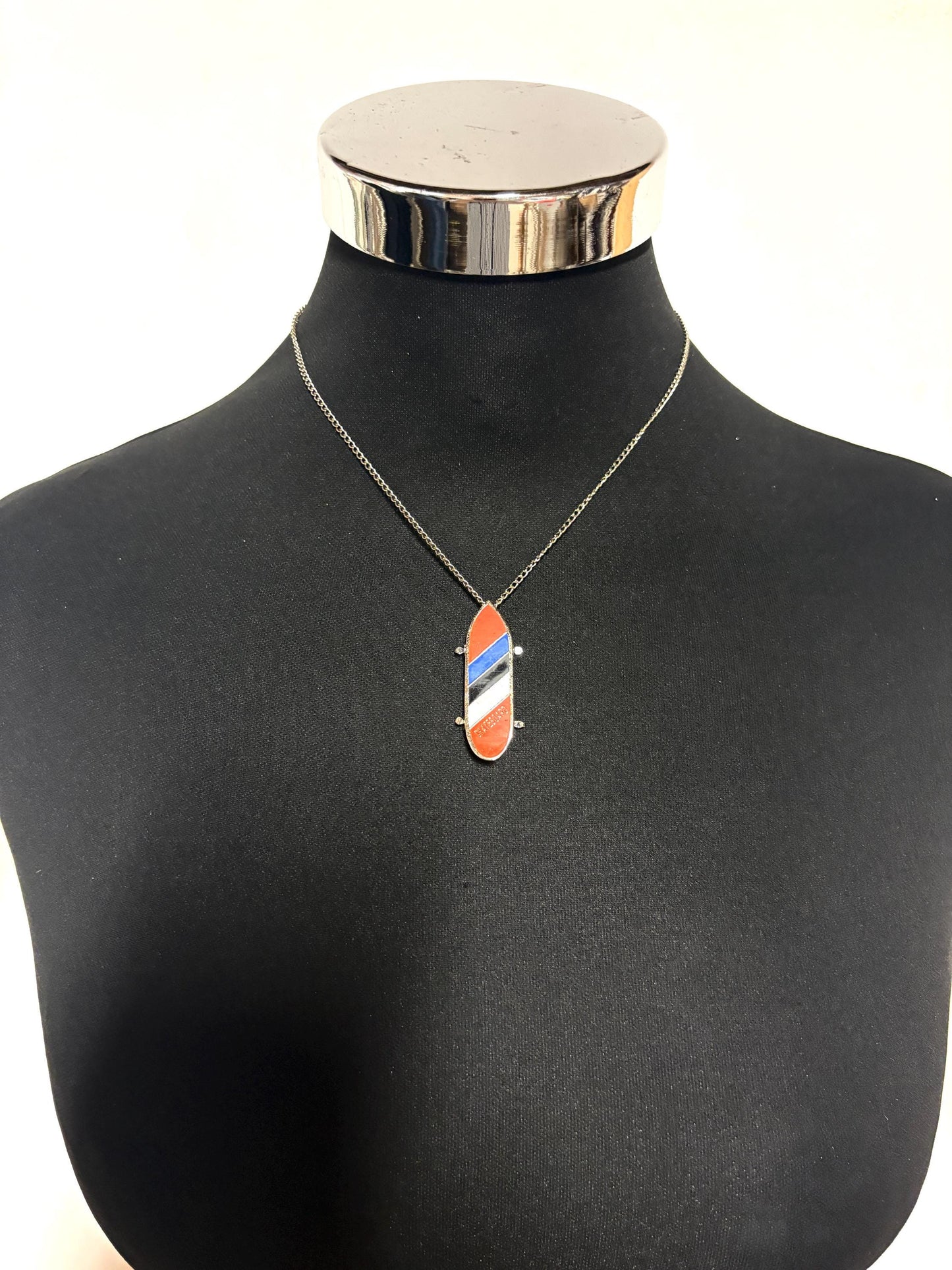 80s vintage skateboard pendant necklace. Metal chrome with enamelled red, blue and white colour stripes. Charming authentic design. NOS