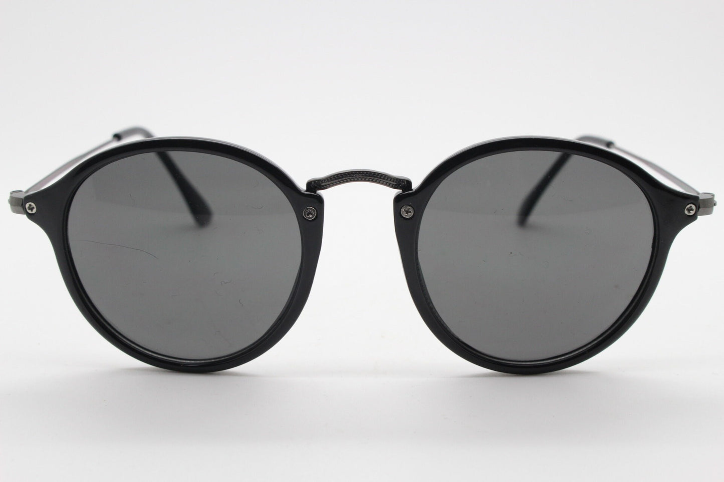 90s vintage round sunglasses. Black gloss slim 30s 40s design frame with metal bridge and dark lenses. Unused NOS