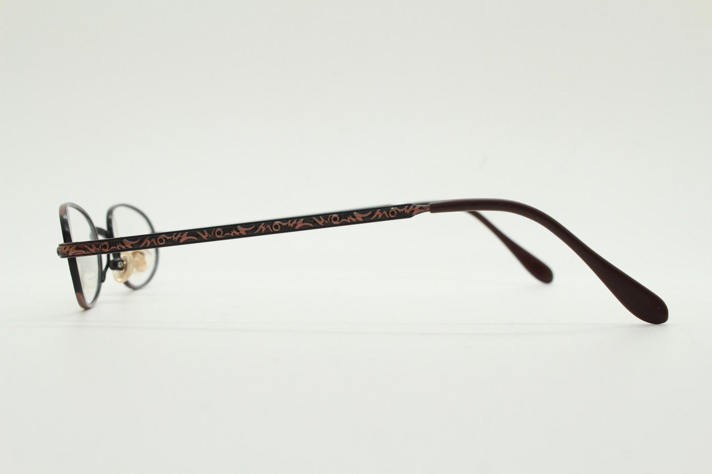 Paris Ma 90s vintage small oval eye glasses. Brushed copper finish optical frames with ornate details. Prescription steampunk spectacles NOS
