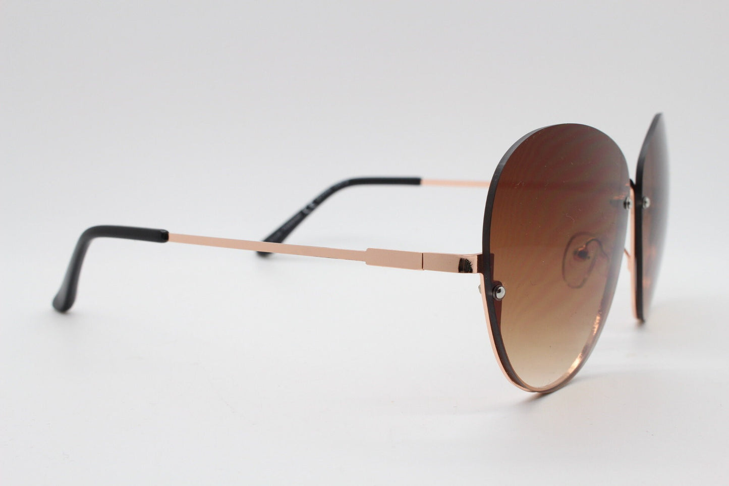 Y2K vintage large rimless sunglasses. Women's 70s style half frame design with graduating brown lenses and gold arms. 2000s BNWT