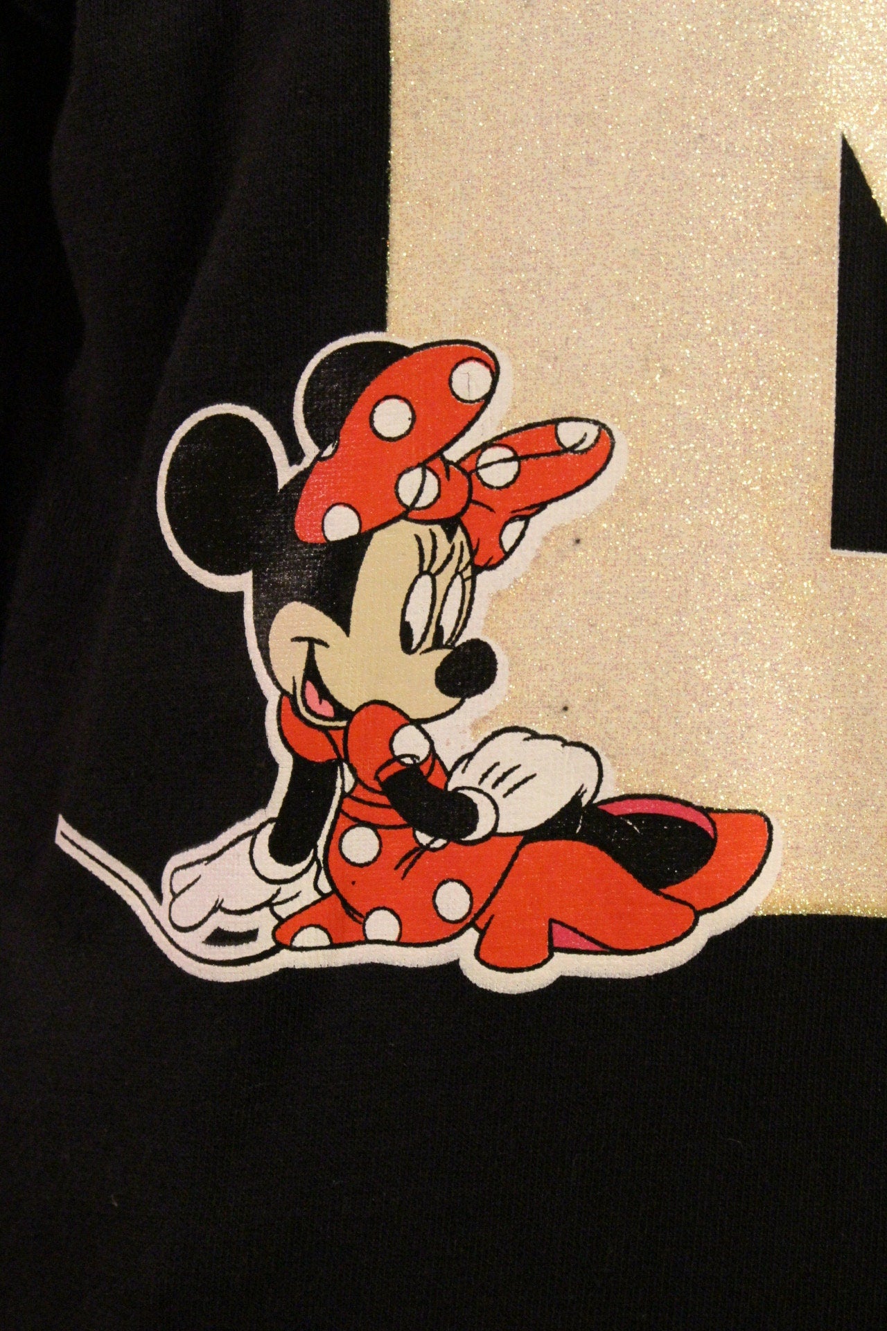 Vintage Y2K Disney Minnie Mouse black sweatshirt with big M logo. Womens crew neck cheerleader pullover