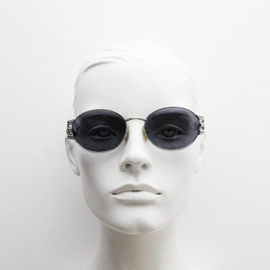 Sunsweet 90s vintage metal oval sunglasses made in Italy. Definitive ornate temple design with classical sun crests in silver chrome. NOS