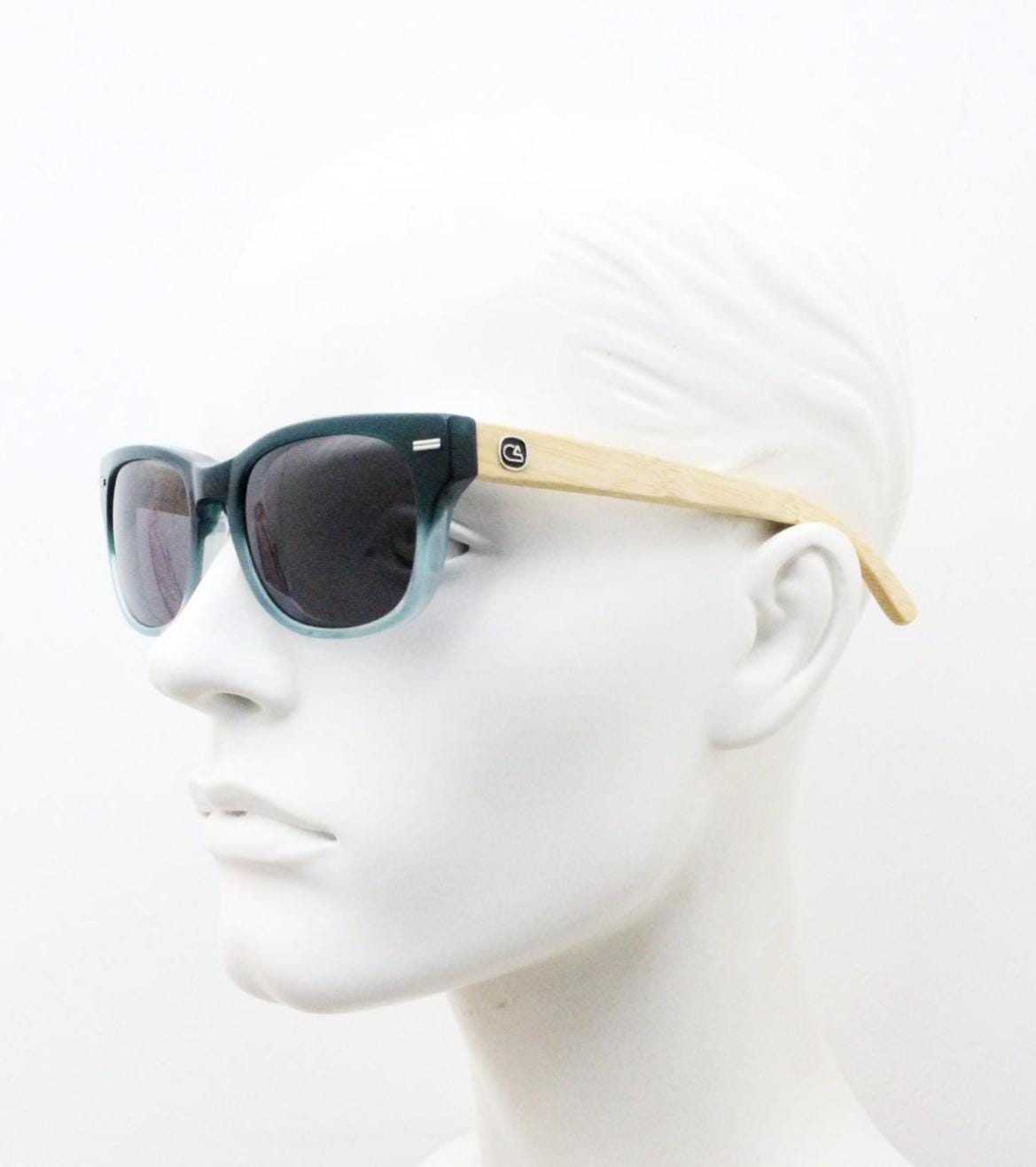 Calisons ryder modified wayfarer design sunglasses. Thickened blue acetate front with natural real wooden arms. Unused NOS