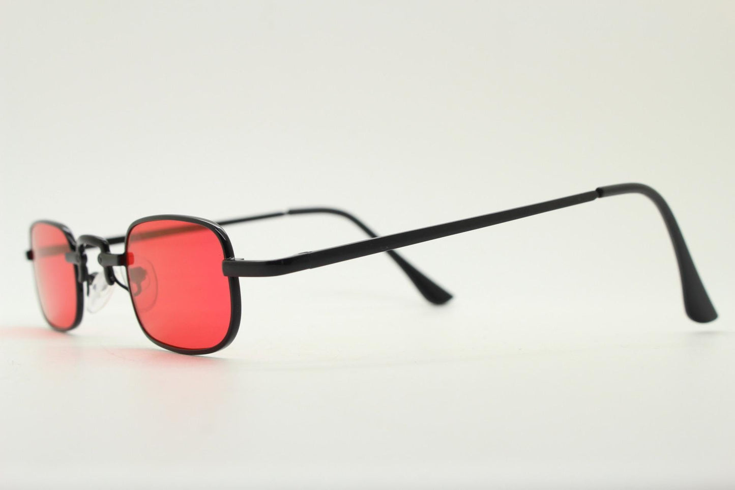90s vintage small rectangular sunglasses. Imposing minimal black metal victorian style frame with deep red lenses. Unused BNWT