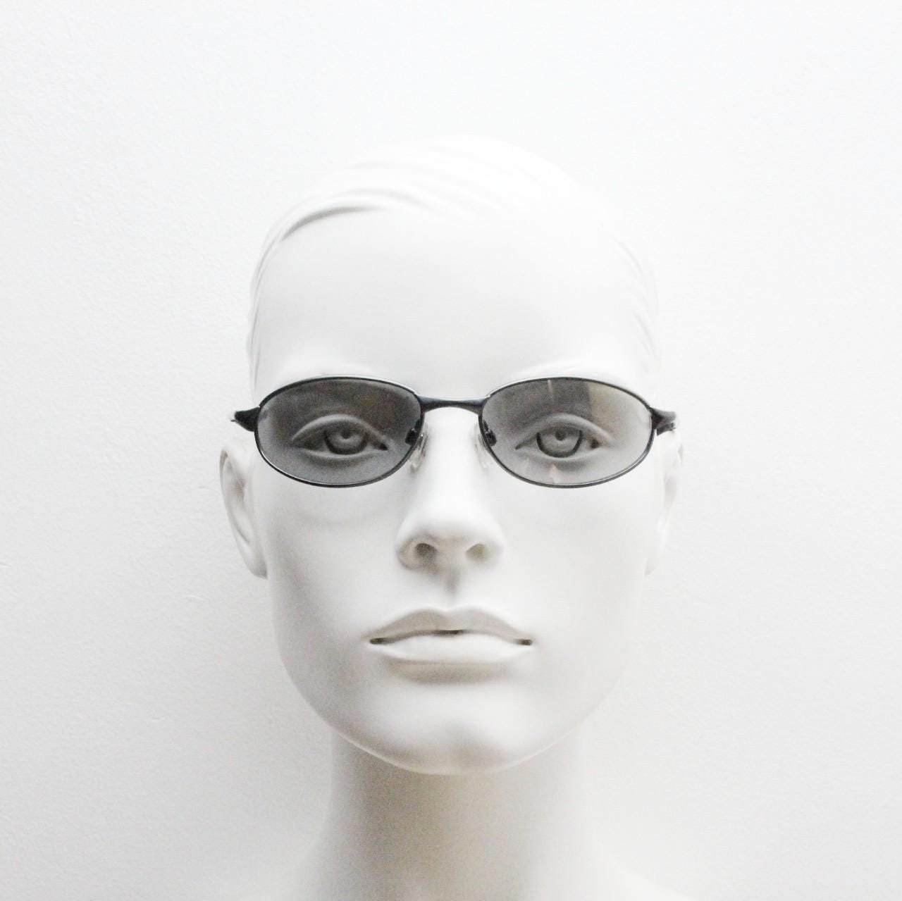 90s vintage oval small  bug eye sunglasses. Satin finish frame in gunmetal with straight spear arms. Y2K. 2000s. Unworn NOS
