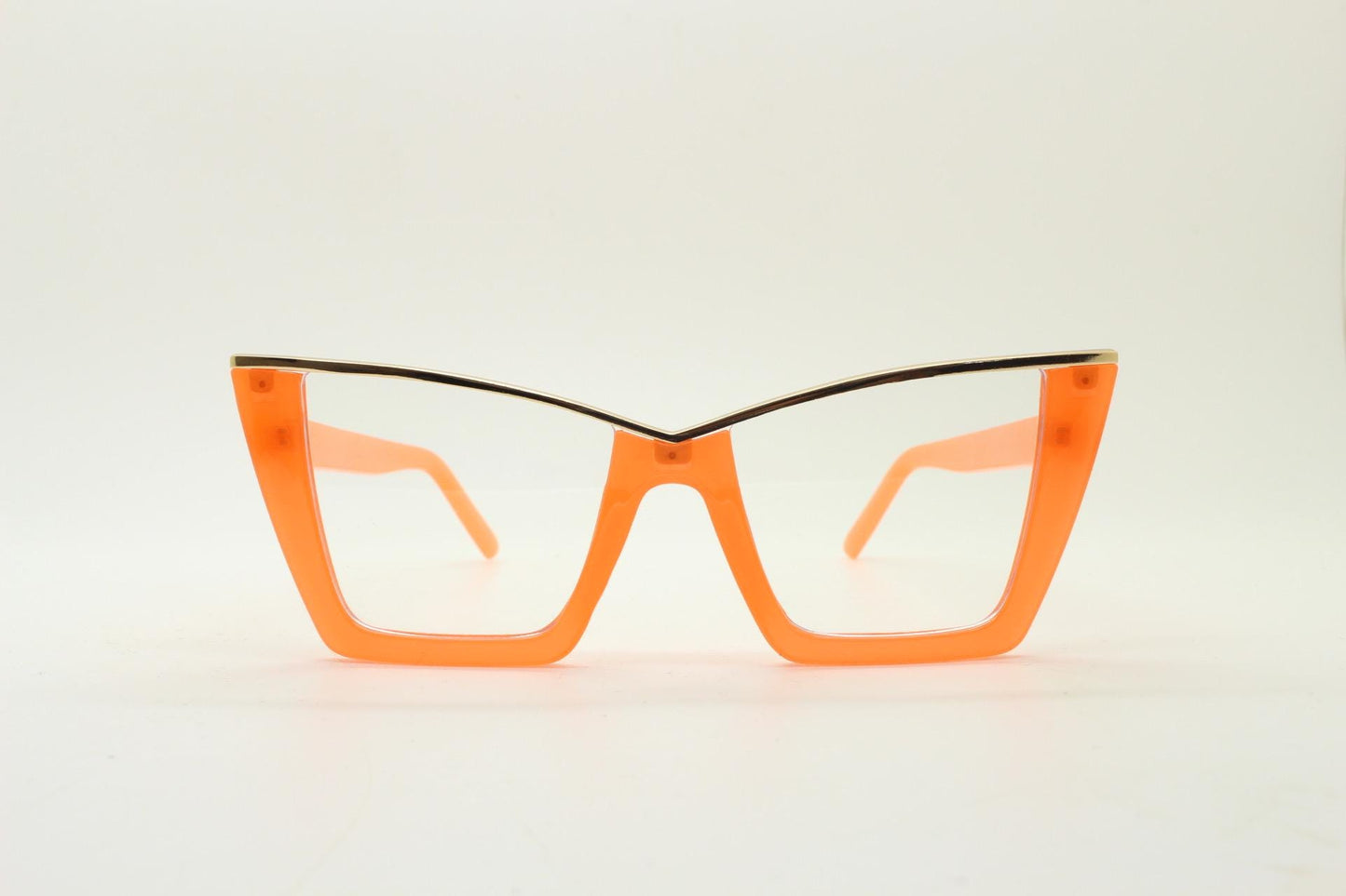 Dynamic pointed cat eye glasses. Transparent thick orange optical frame with gold metal 'owl' brow. and clear lenses. Vintage. Prescription