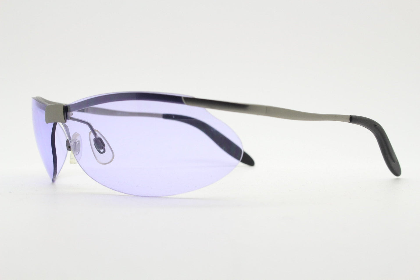 Y2K vintage sport shield sunglasses. 2000's half frame wraparound aerodynamic mini mask visor with purple bug eye lenses. 90s 00s unused NOS