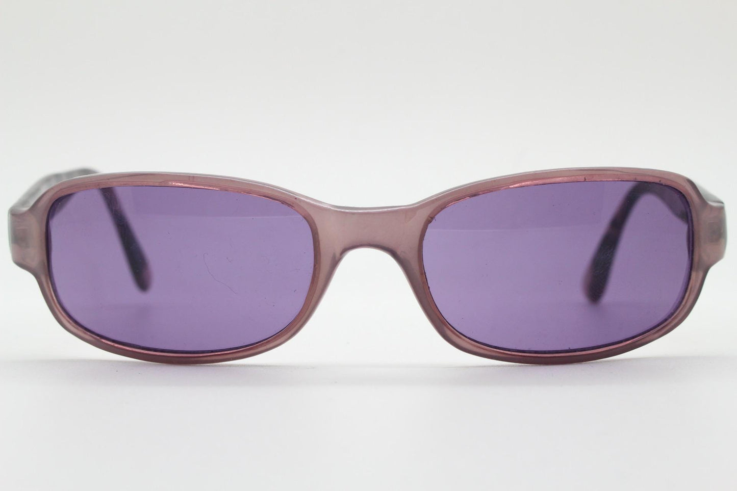 Y2k vintage wrap around sunglasses. Curved low profile frame with extraordinary purple turtle arms and well matched lenses. 2000's NOS