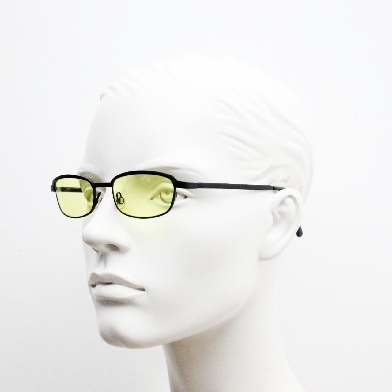 Vintage small rectangular sunglasses. Authentic quirky 90s design in a matt black solid metal frame with bright yellow lenses. 2000s. NOS
