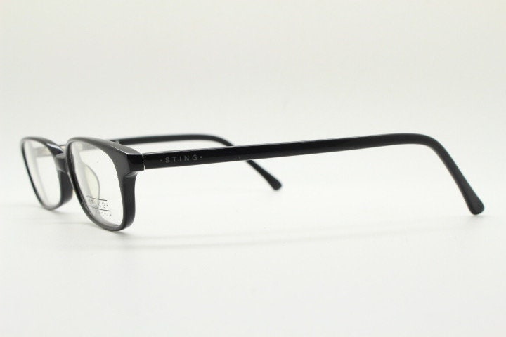 Sting 90s vintage rectangular eye glasses made in Italy. Plain black gloss low profile acetate optical frames. Prescription RX. NOS