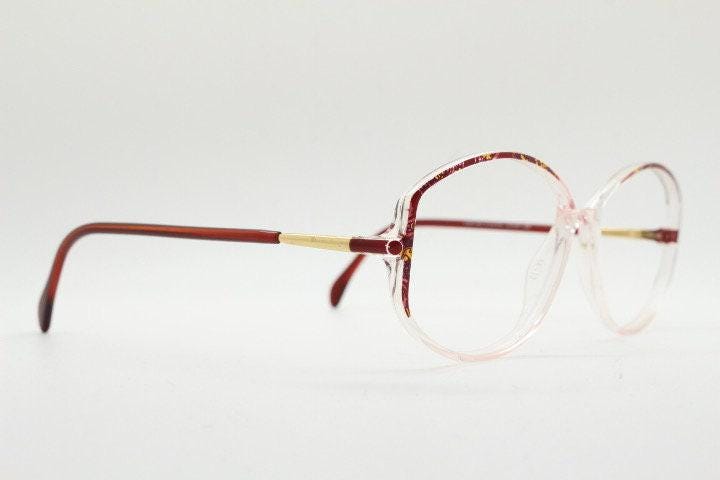 Silhouette 80s vintage hexagon eye glasses made in Austria. Transparent crystal optical frame with abstract red pattern. Prescription RX
