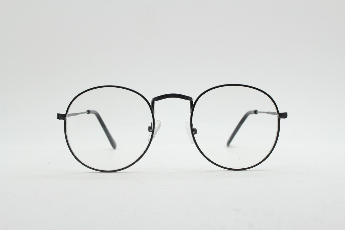 90s vintage round metal glasses. Classic 60s panto design black frame with clear lenses in excellent proportions. Unused NOS eyeglasses