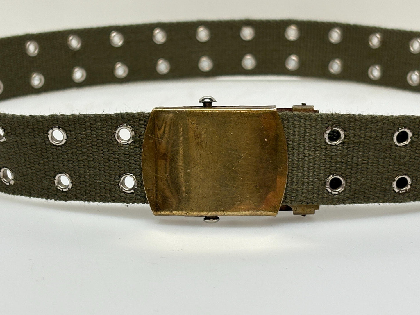 90s vintage canvas army style belt. Khaki green with 2 rows of silver metal holes. Slide lock gold buckle. Webbing. Fully adjustable