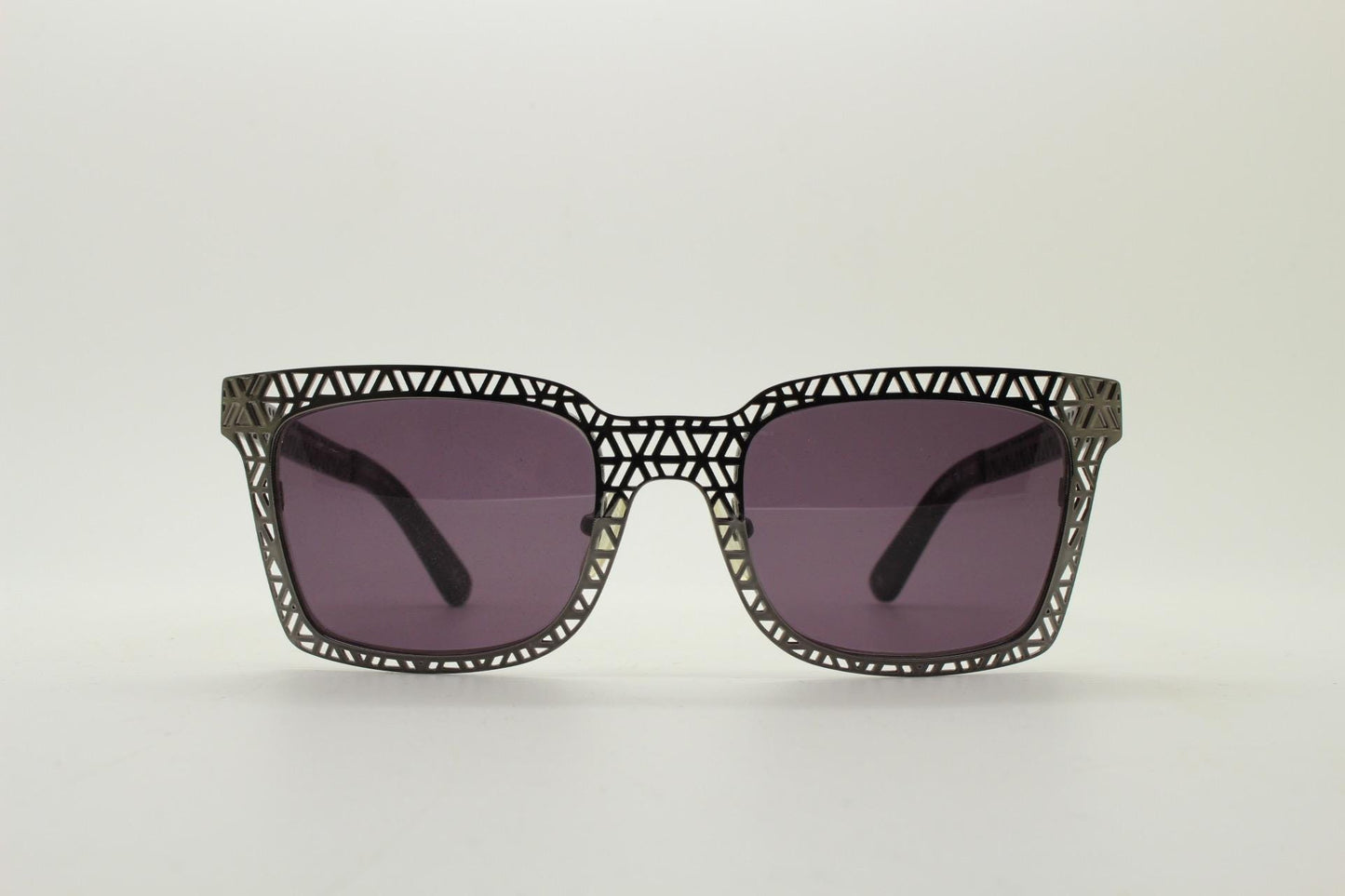 Sass and bide vintage wayfarer shape sunglasses. Gunmetal grey flat metal frame with cut out patterns throughout and black lenses. 2000s NOS