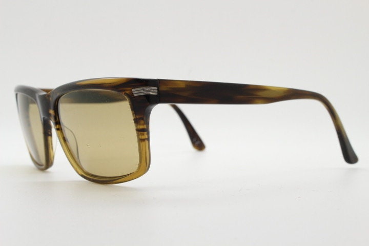 Oliver Peoples vintage rectangular sunglasses model Maceo. Handsome transparent mottled honey brown acetate frame with mid tone lenses
