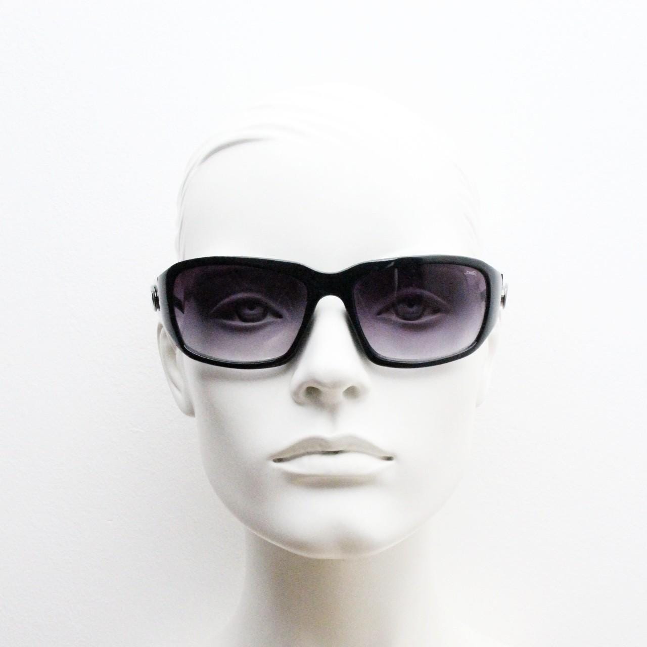 Y2k vintage wrap around bug eye sunglasses. Substantial curved black shield frame with arm holes. Modified 60s biker design. 2000's NOS