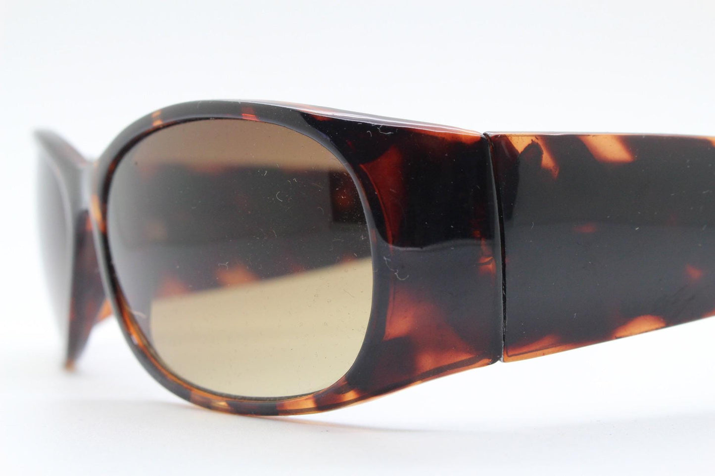 Y2k vintage wrap around bug eye sunglasses. Aerodynamic 60s design tortoise frame with full height arms in excellent proportions. 2000's NOS