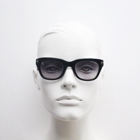 Tom Ford vintage modified wayfarer sunglasses made in Italy. Slightly cat eye form in black gloss acetate with superb graduating lenses